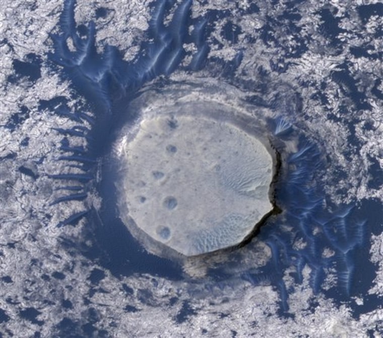 An image from NASA's Mars Reconnaissance Orbiter shows an inverted crater in the Red Planet's Arabia Terra region.
